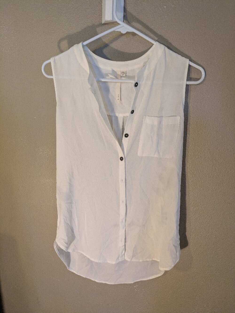 White button-up sleeveless blouse